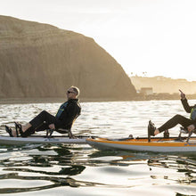 A man and a woman pedal around the bay on Hobie Mirage Lynx Kayaks | SKU: 27100035-23